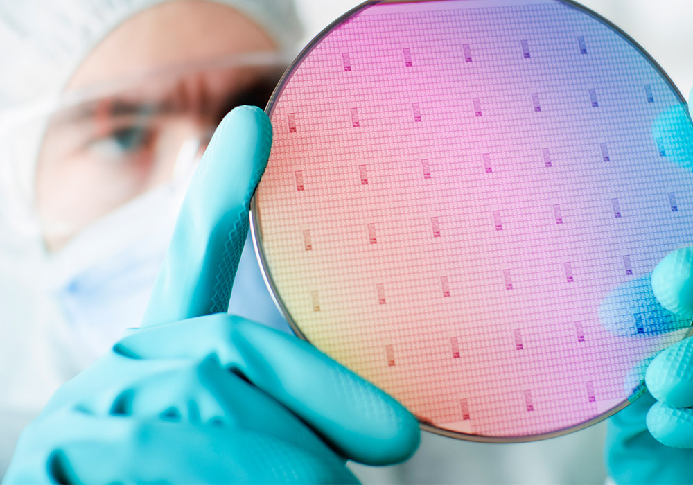 Image of a scientist looking at a wafer